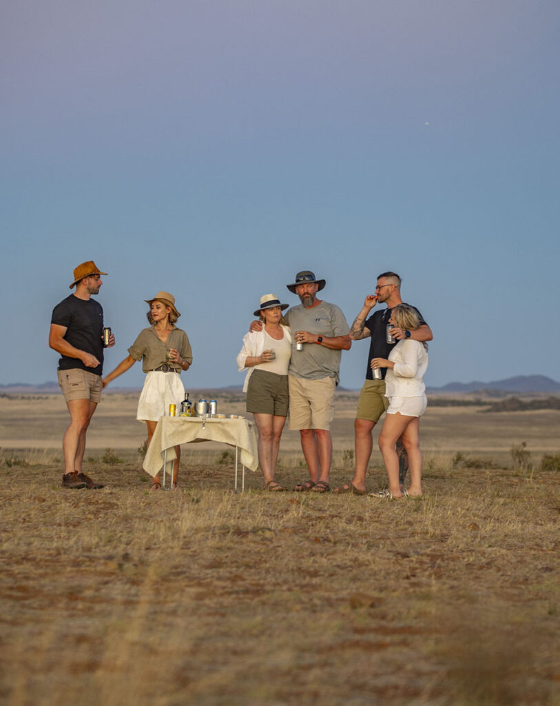 Guests enjoying drinks in the bush